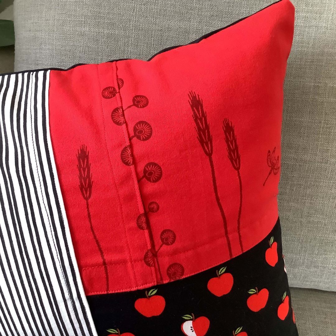 Close up of detail on Apples and Lines cushion cover