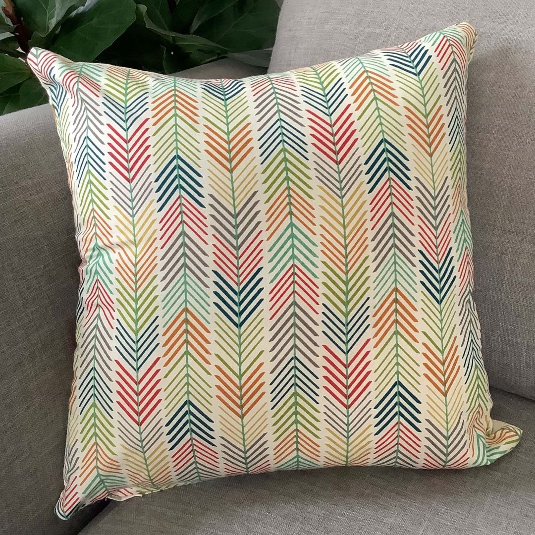 Reverse side of out of africa cushion cover on a couch