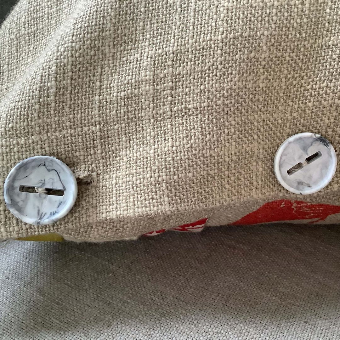 Buttons on until nothing remains cushion cover