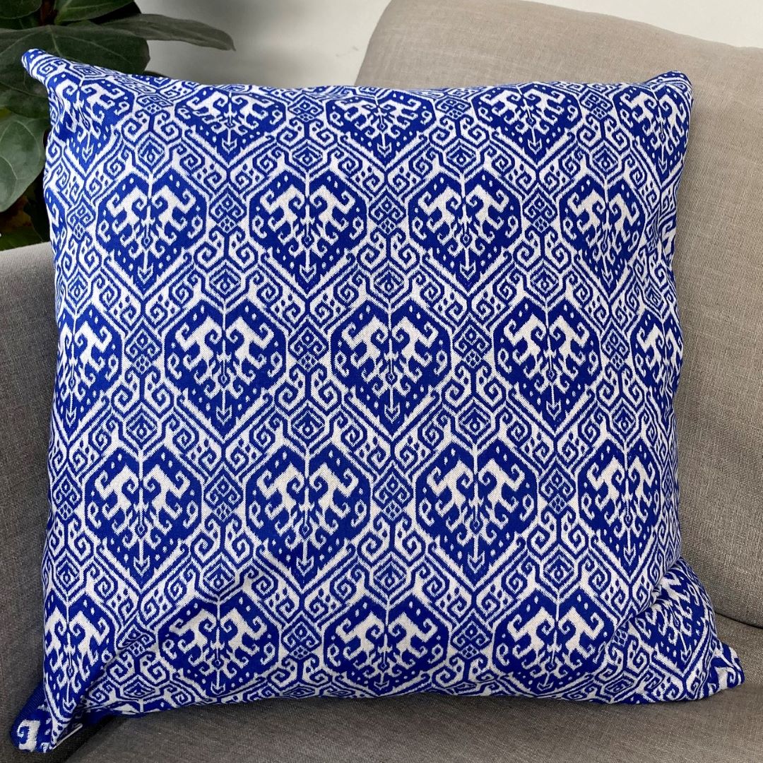 Blue block print cushion cover on a couch