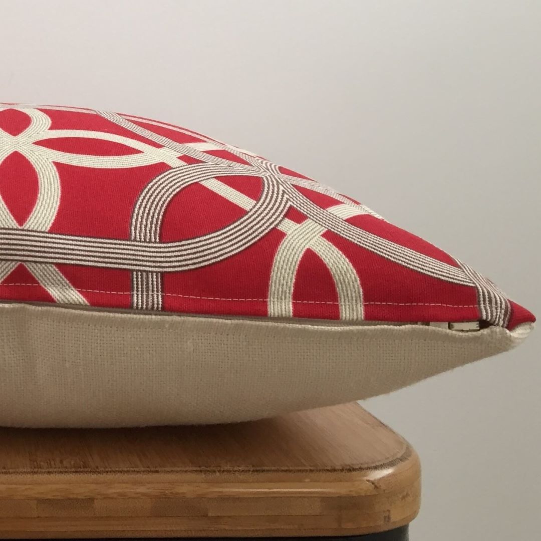 Side view of Red Geometric cushion cover showing zip detail and back fabric