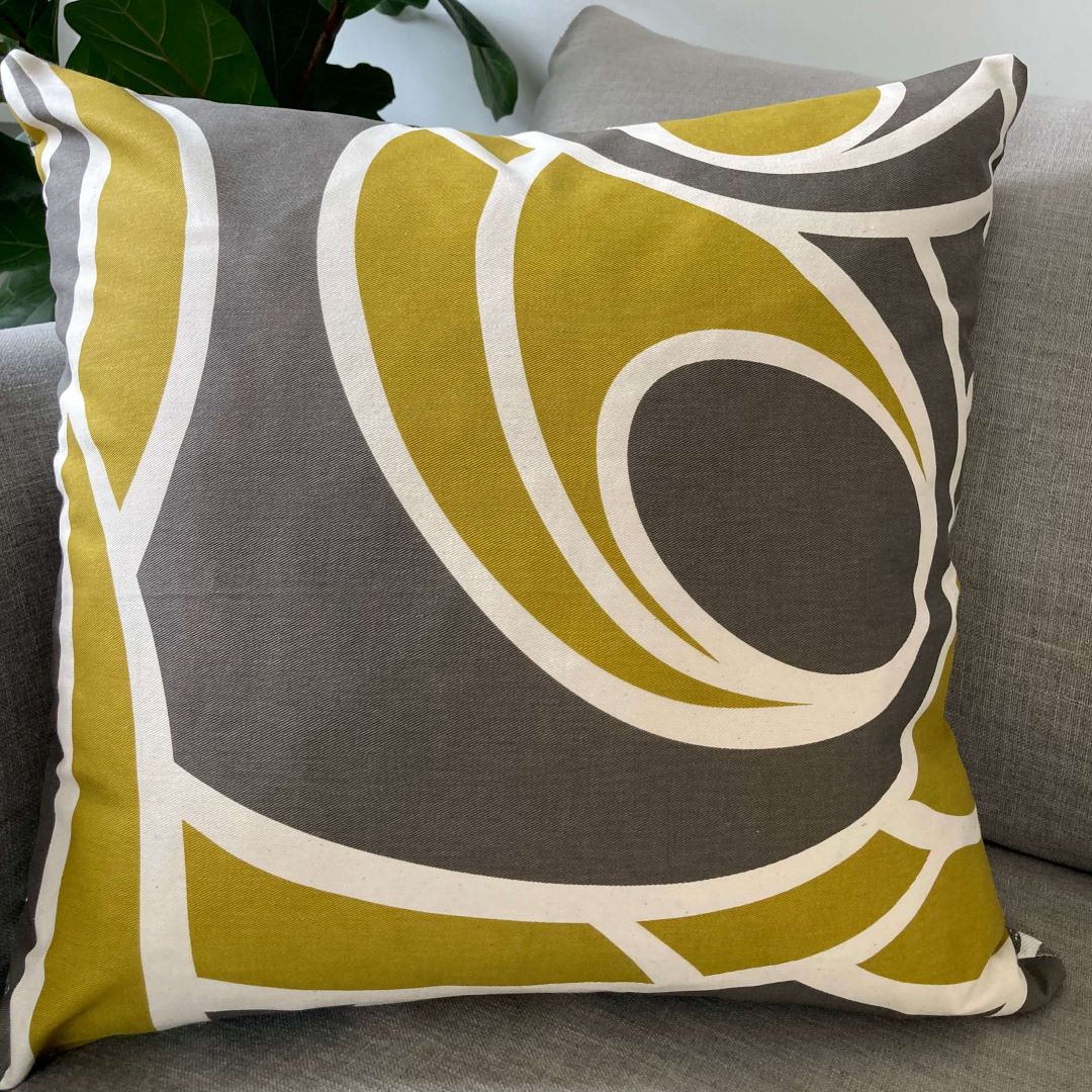 Waves and Swirls cushion covers, showing swirls, on a couch