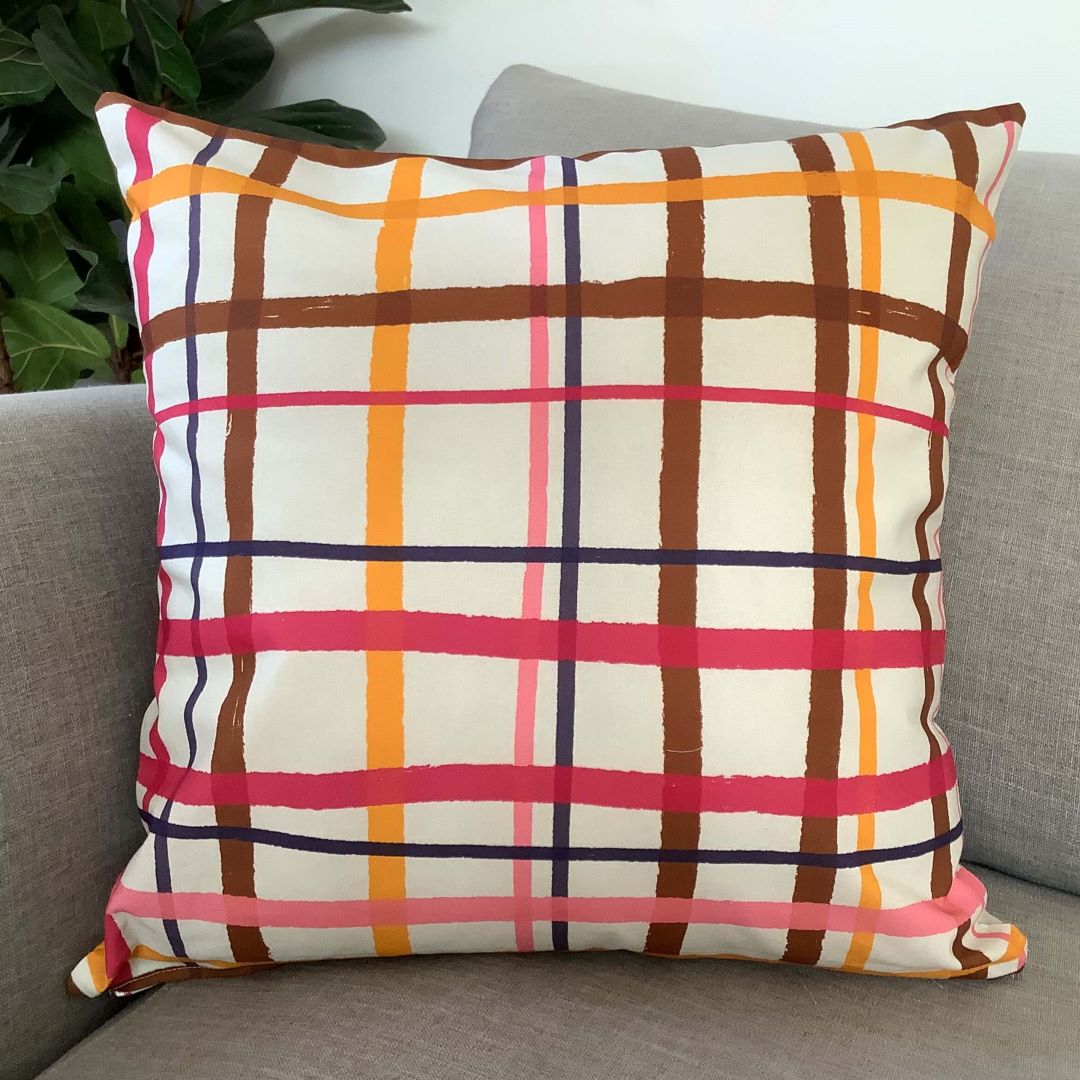Jungle gingham cushion cover on a couch