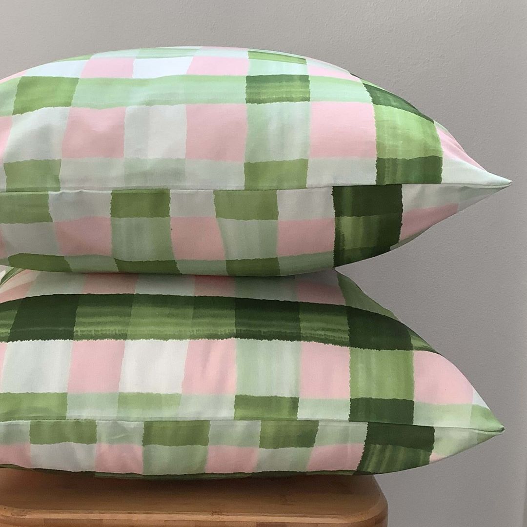 Stacked image of Gingham cushion cover in olive and pink showing front and back