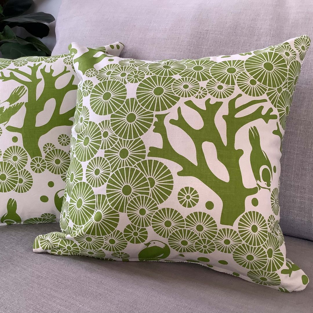 two 'Mikko' cushion covers in lime green on a couch