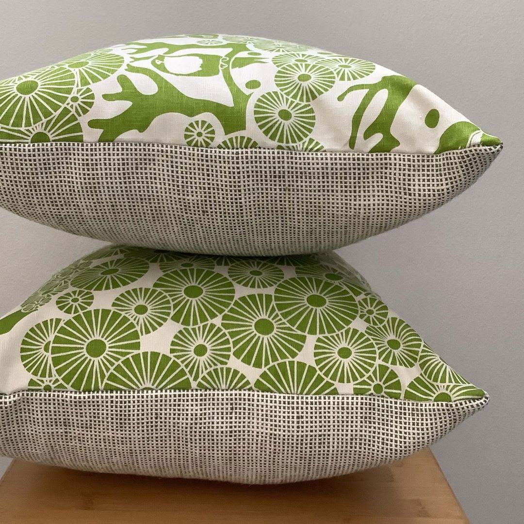two 'Mikko' cushion covers in lime green stacked