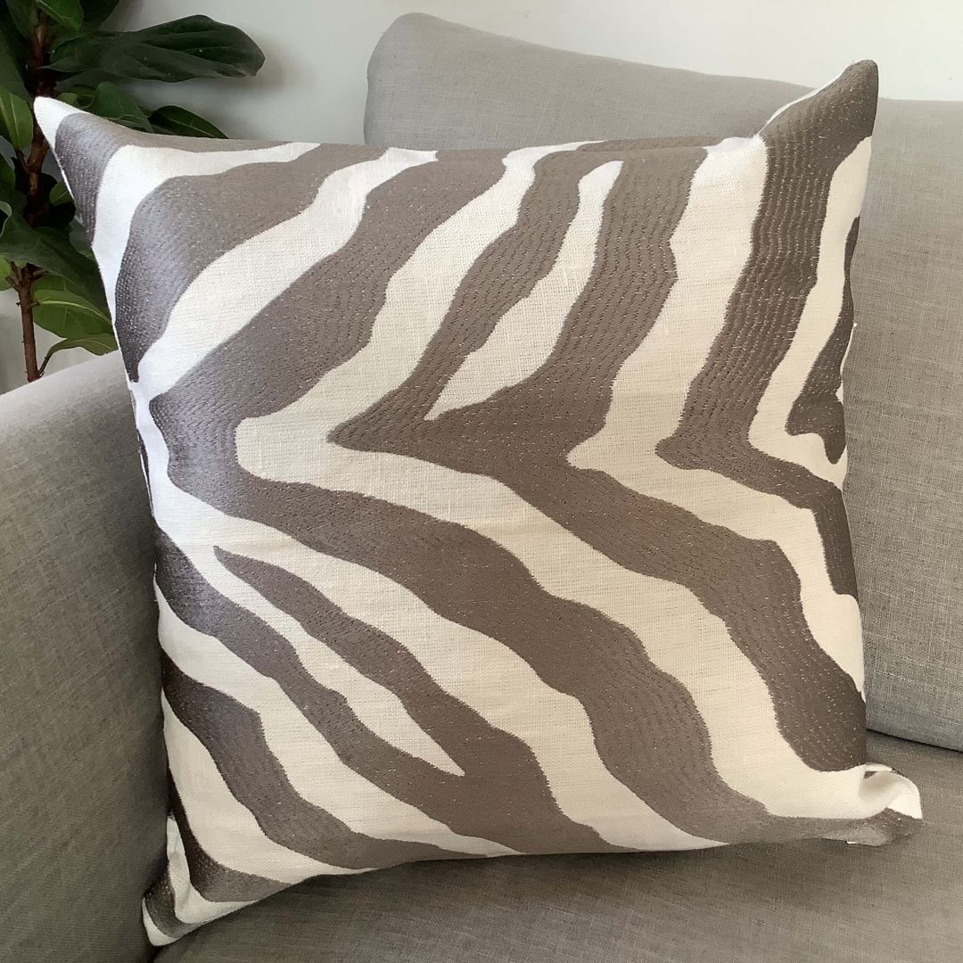 Zebra cushion cover on a couch